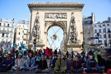 Climate change protesters block central Paris square to protest election choices
