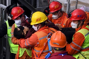 Eleven trapped miners rescued in China after 14 days underground